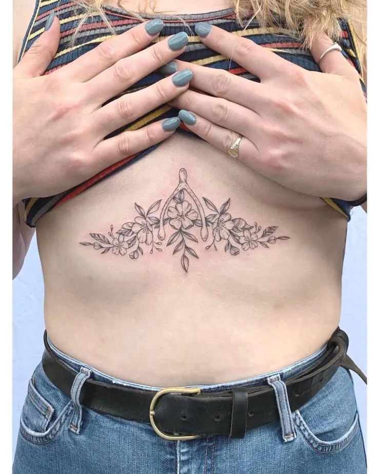 wishbone sternum tattoo