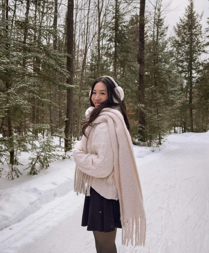 cream knitted jumper with a black skirt