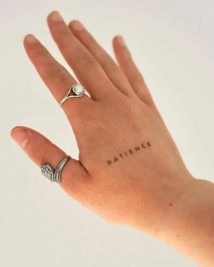  “patience” tattoo on the hand