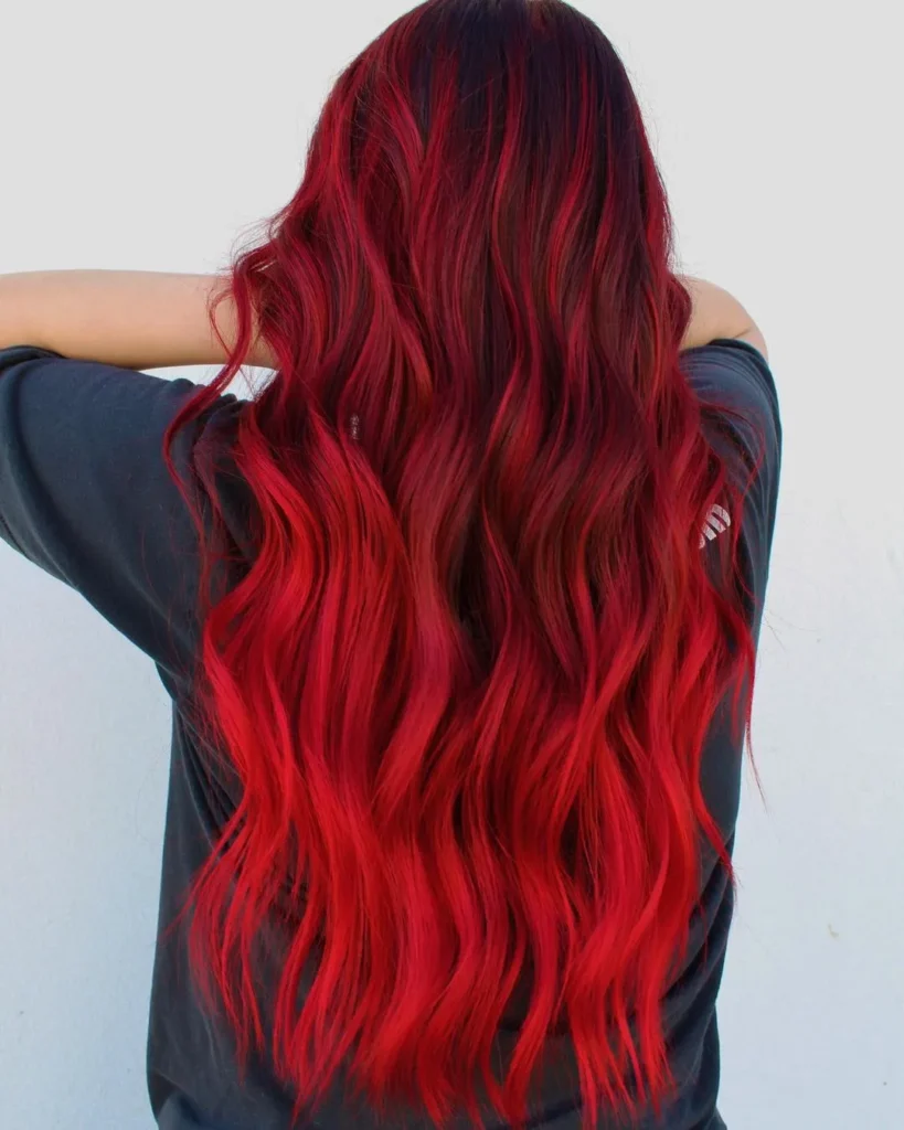 Bright neon shades of dark red hair with highlights